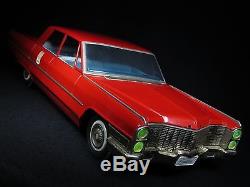 25 ½ LARGE CADILLAC DeVILLE RED TIN FRICTION TOY CAR T. N. NOMURA JAPAN WORKS