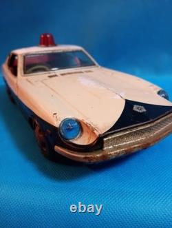 A 1970s Nissan Fairlady Z tin toy, made in Japan, 30cm long, police car