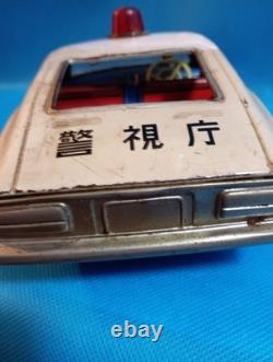 A 1970s Nissan Fairlady Z tin toy, made in Japan, 30cm long, police car