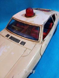 A 1970s Nissan Fairlady Z tin toy, made in Japan, 30cm long, police car