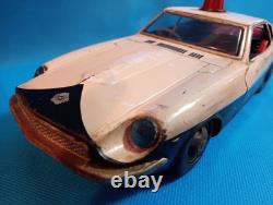 A 1970s Nissan Fairlady Z tin toy, made in Japan, 30cm long, police car