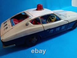 A 1970s Nissan Fairlady Z tin toy, made in Japan, 30cm long, police car