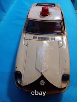 A 1970s Nissan Fairlady Z tin toy, made in Japan, 30cm long, police car