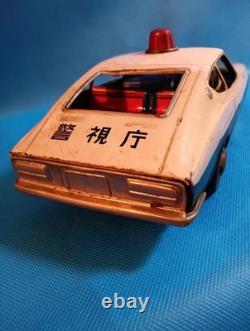 A 1970s Nissan Fairlady Z tin toy, made in Japan, 30cm long, police car