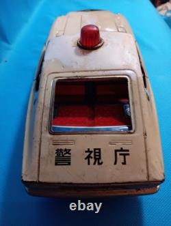 A 1970s Nissan Fairlady Z tin toy, made in Japan, 30cm long, police car