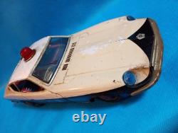 A 1970s Nissan Fairlady Z tin toy, made in Japan, 30cm long, police car