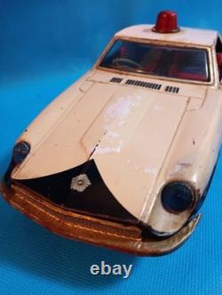 A 1970s Nissan Fairlady Z tin toy, made in Japan, 30cm long, police car