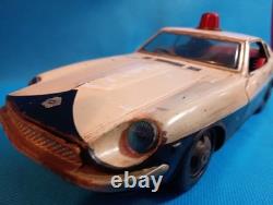 A 1970s Nissan Fairlady Z tin toy, made in Japan, 30cm long, police car