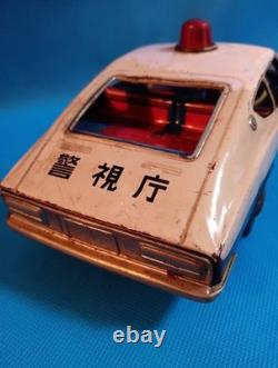 A 1970s Nissan Fairlady Z tin toy, made in Japan, 30cm long, police car