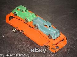 ARCADE CAR TRANSPORTER CAST IRON TRAILER AND TWO CARS MISSING 2 AUTOS