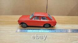 Datsun (Nissan) Sunny 1000. Red car tin toys Japan. Vintage retro car litho tin