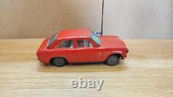 Datsun (Nissan) Sunny 1000. Red car tin toys Japan. Vintage retro car litho tin