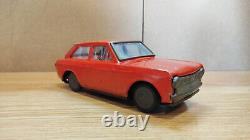 Datsun (Nissan) Sunny 1000. Red car tin toys Japan. Vintage retro car litho tin