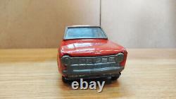 Datsun (Nissan) Sunny 1000. Red car tin toys Japan. Vintage retro car litho tin