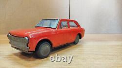 Datsun (Nissan) Sunny 1000. Red car tin toys Japan. Vintage retro car litho tin