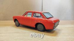 Datsun (Nissan) Sunny 1000. Red car tin toys Japan. Vintage retro car litho tin