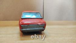 Datsun (Nissan) Sunny 1000. Red car tin toys Japan. Vintage retro car litho tin