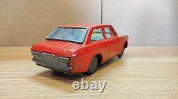 Datsun (Nissan) Sunny 1000. Red car tin toys Japan. Vintage retro car litho tin