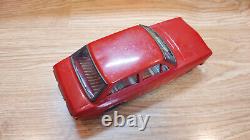 Datsun (Nissan) Sunny 1000. Red car tin toys Japan. Vintage retro car litho tin