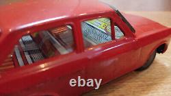 Datsun (Nissan) Sunny 1000. Red car tin toys Japan. Vintage retro car litho tin