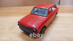 Datsun (Nissan) Sunny 1000. Red car tin toys Japan. Vintage retro car litho tin