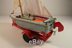 NEW CAR (FORD) WITH SAILBOAT TRAILER, Japan Haji friction tin toy 1950s MIB RARE