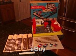 REMCO MOVIELAND DRIVE IN with PLATFORM, BOX, 4 CARS, 5 FILM STRIPS, BATTERY COVER