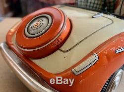 T. N NOMURA Spyder Convertible DRIVING PET Tin Litho Dog Car Battery Japan 1950s