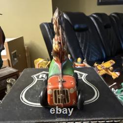 Tin Windup Monkey Driving A Car