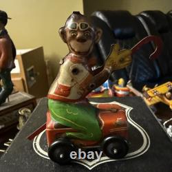 Tin Windup Monkey Driving A Car