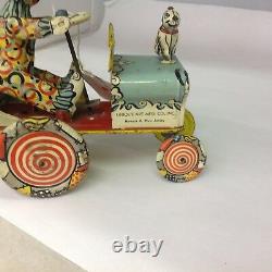 VINTAGE UNIQUE ART MFG. CO. ARTIE THE CLOWN Tin Wind Up Toy Car. 591-G