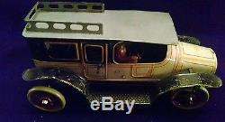 Vintage German Windup Tin Touring Car Toy with Latching Doors and Crank