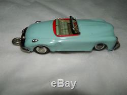 Vintage Japan tin toy trailer with car