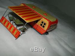 Vintage Japan tin toy trailer with car
