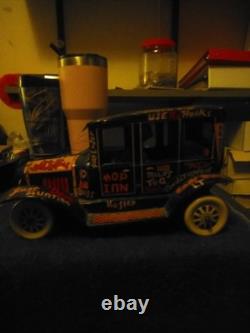 Vintage Lewis marks 10 lithograph wind-up toy car. Old Jalopy
