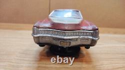 Vintage retro car litho tin toy Japan. Cadillac Fleetwood Eldorado car Battery