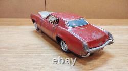 Vintage retro car litho tin toy Japan. Cadillac Fleetwood Eldorado car Battery