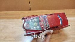 Vintage retro car litho tin toy Japan. Cadillac Fleetwood Eldorado car Battery