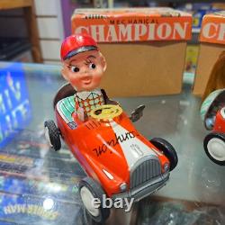 Vintage tin racing car japan kanto toys boy and girl working