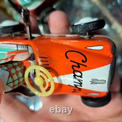 Vintage tin racing car japan kanto toys boy and girl working