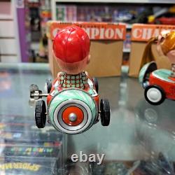 Vintage tin racing car japan kanto toys boy and girl working
