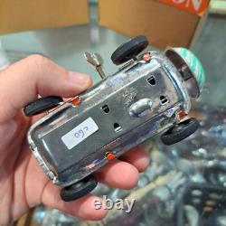 Vintage tin racing car japan kanto toys boy and girl working