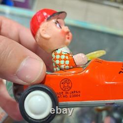Vintage tin racing car japan kanto toys boy and girl working